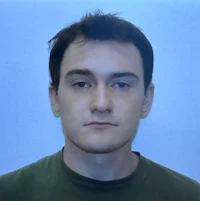 a man in a green shirt is posing for a photo